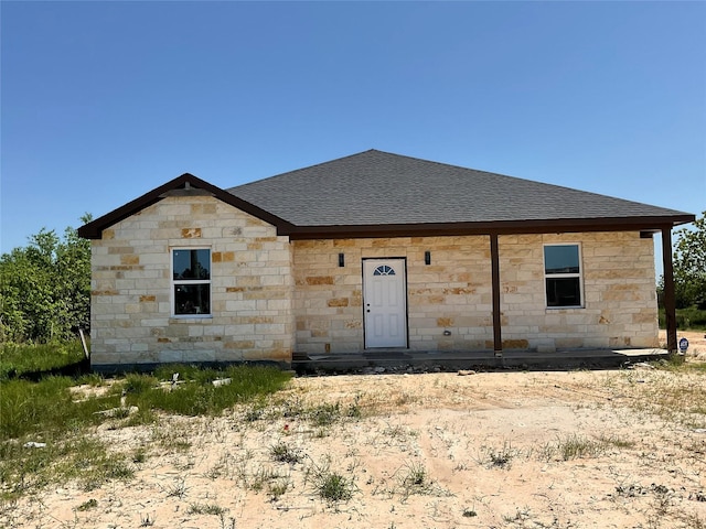 818 Rd 5607, Cleveland, TX 77327 - view of front of home with stone siding and a shingled roof