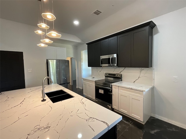 818 Rd 5607, Cleveland, TX 77327 - kitchen featuring a sink, visible vents, decorative backsplash, light stone counters, and appliances with stainless steel finishes