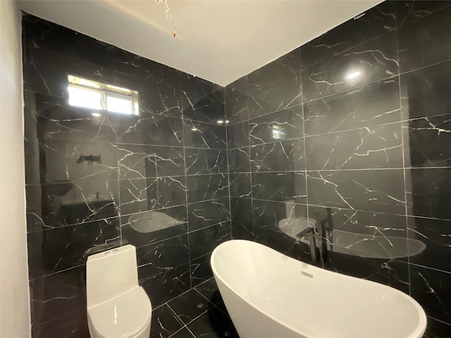 818 Rd 5607, Cleveland, TX 77327 - bathroom featuring a soaking tub and tile walls