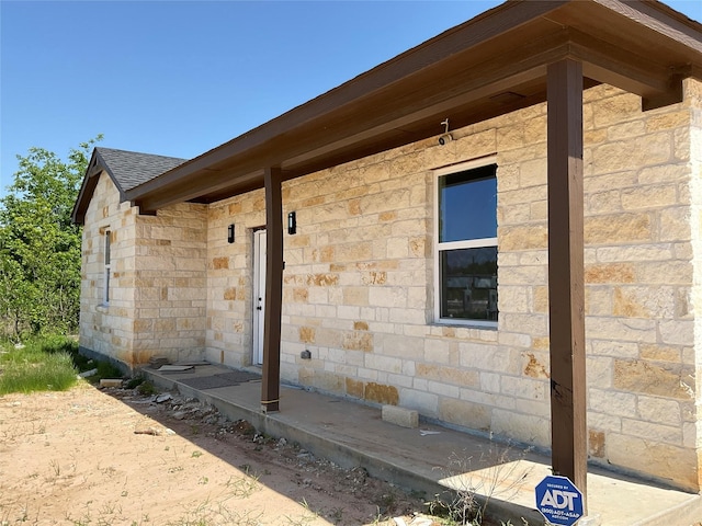 818 Rd 5607, Cleveland, TX 77327 - view of property exterior featuring roof with shingles and stone siding