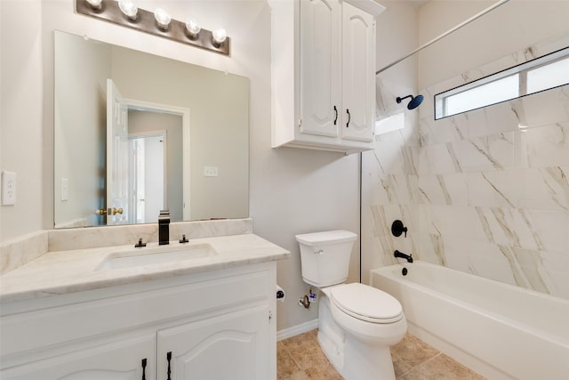 bathroom featuring toilet, vanity, and bathing tub / shower combination