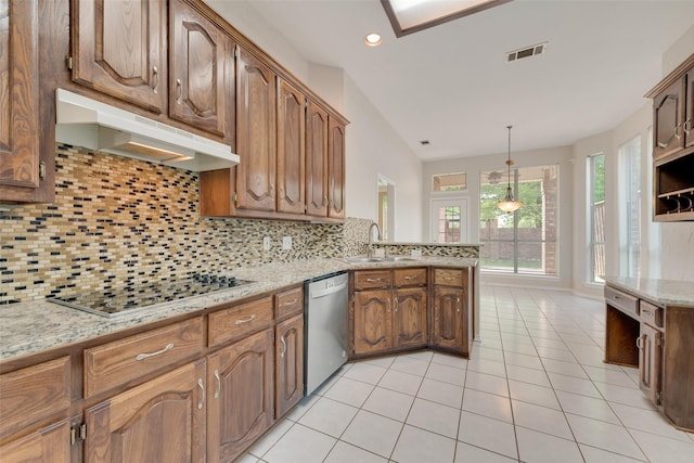 kitchen featuring stainless steel dishwasher, electric stovetop, a sink, under cabinet range hood, and visible vents