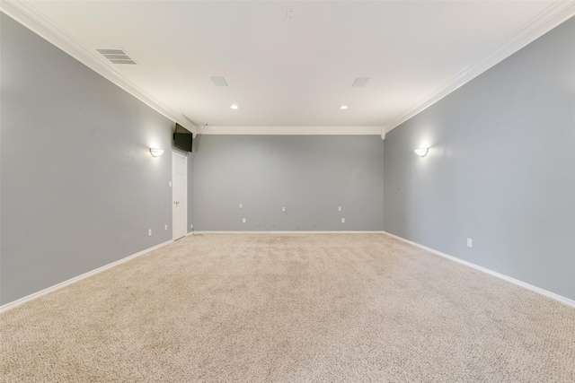 unfurnished room with visible vents, light carpet, baseboards, and ornamental molding