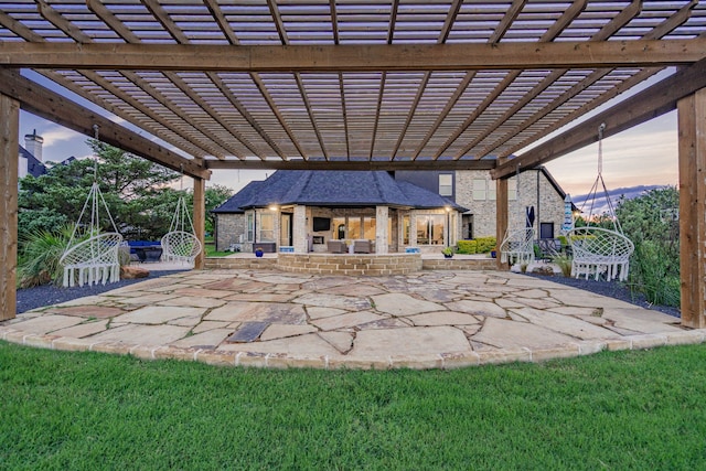 147 Stoneleigh Dr, Heath, TX 75032 - patio terrace at dusk featuring a patio area and a pergola