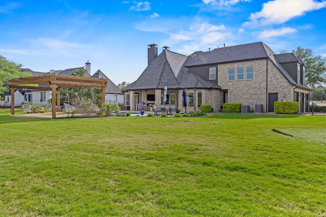 back of property featuring a pergola, central AC, brick siding, a patio area, and a lawn