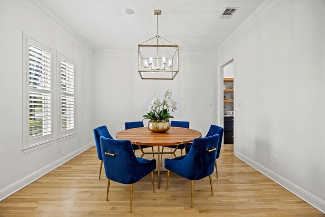 147 Stoneleigh Dr, Heath, TX 75032 - dining room featuring a chandelier, light wood-style floors, plenty of natural light, baseboards, and crown molding
