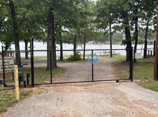 113 Daniel Dr, Mabank, TX 75156 - view of gate featuring a water view and fence