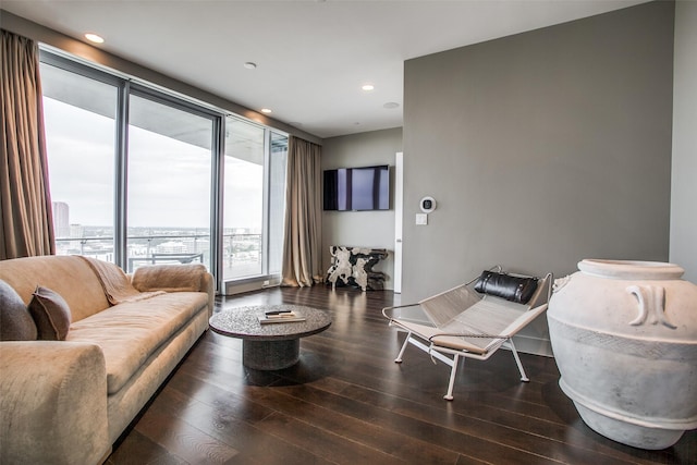 living room featuring recessed lighting, wood finished floors, and plenty of natural light