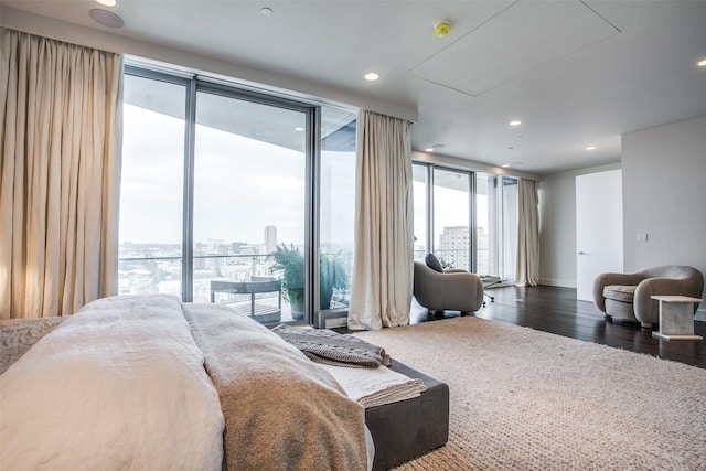 bedroom with attic access, dark wood-style flooring, access to exterior, and recessed lighting