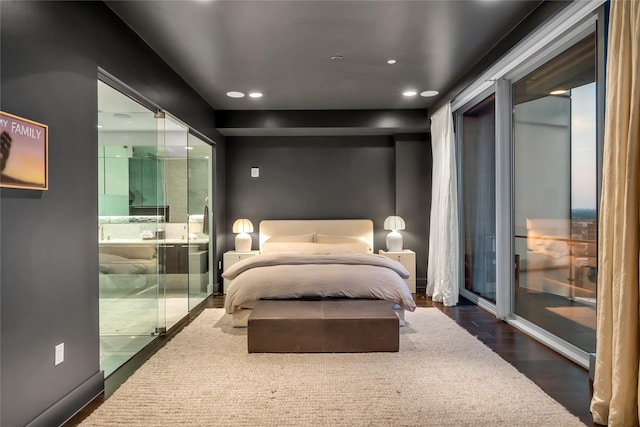 bedroom featuring ensuite bath, access to outside, dark wood-style floors, and recessed lighting