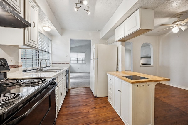 kitchen featuring dark wood-style flooring, ceiling fan, under cabinet range hood, butcher block counters, and black appliances