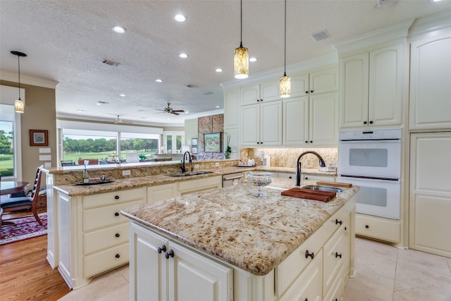 6001 Laurel Valley Ct, Fort Worth, TX 76132 - kitchen with white double oven, recessed lighting, a kitchen island with sink, a peninsula, and dishwasher