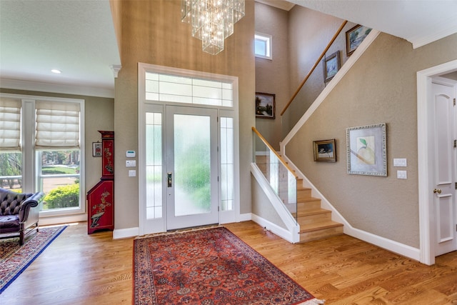 6001 Laurel Valley Ct, Fort Worth, TX 76132 - foyer featuring stairs, crown molding, a chandelier, and light wood-type flooring