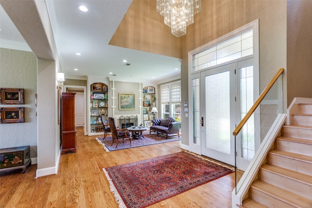 6001 Laurel Valley Ct, Fort Worth, TX 76132 - entryway featuring light wood-type flooring, stairway, a chandelier, a textured wall, and recessed lighting