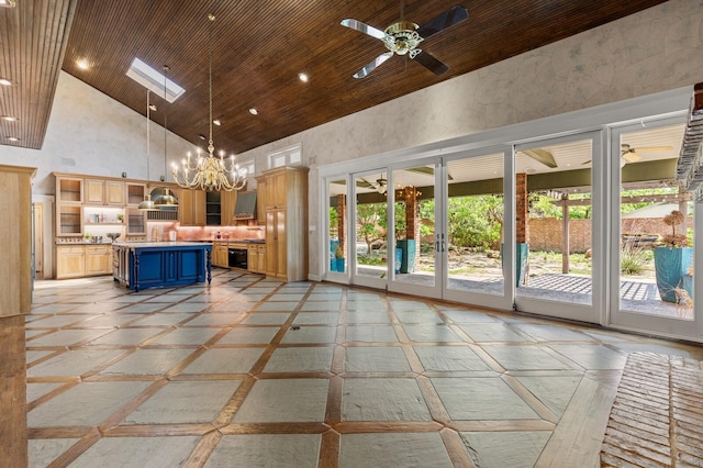 kitchen with high vaulted ceiling, blue cabinets, glass insert cabinets, pendant lighting, and light countertops
