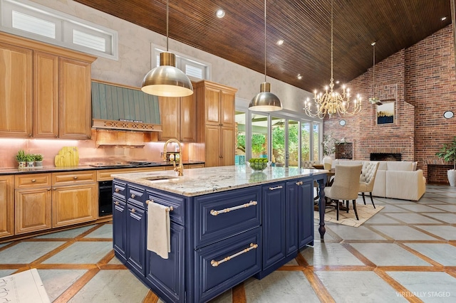 kitchen with blue cabinets, wood ceiling, a notable chandelier, and high vaulted ceiling