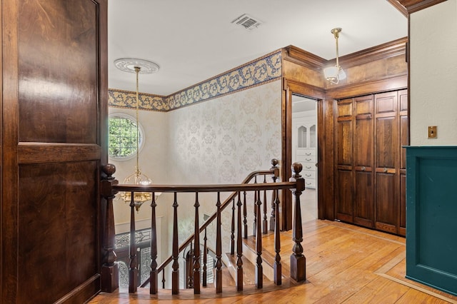 foyer with visible vents and hardwood / wood-style flooring