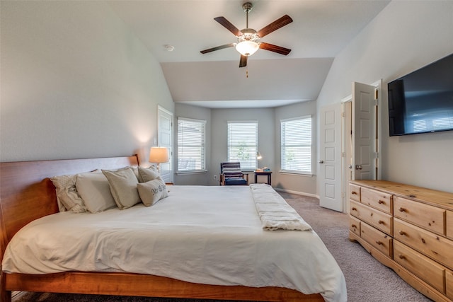 bedroom featuring ceiling fan, light carpet, and vaulted ceiling
