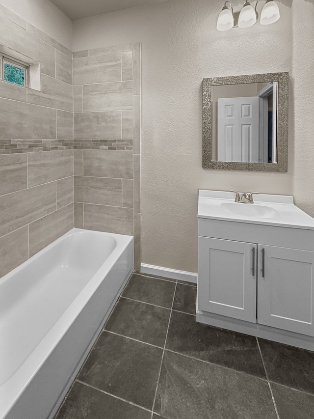 921 E Harvey Ave, Fort Worth, TX 76104 - full bathroom with vanity, tile patterned flooring, baseboards, and shower / tub combination