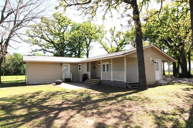 10139 Fm 3441, Malakoff, TX 75148 - back of property featuring a lawn and covered porch