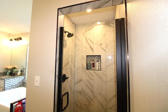 full bath featuring a shower stall and vanity