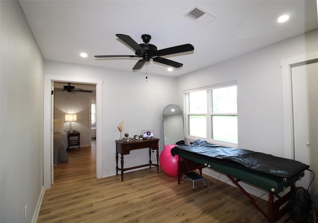 bedroom featuring recessed lighting, wood finished floors, visible vents, a ceiling fan, and baseboards