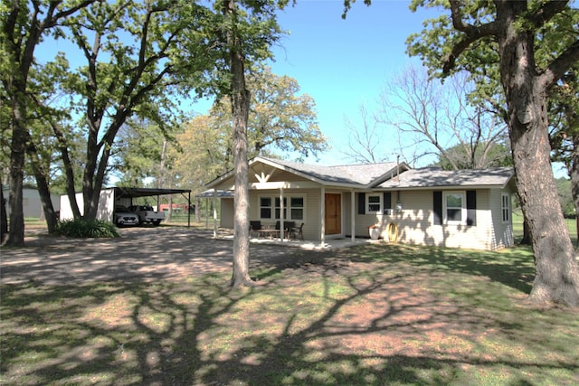 rear view of house featuring a yard