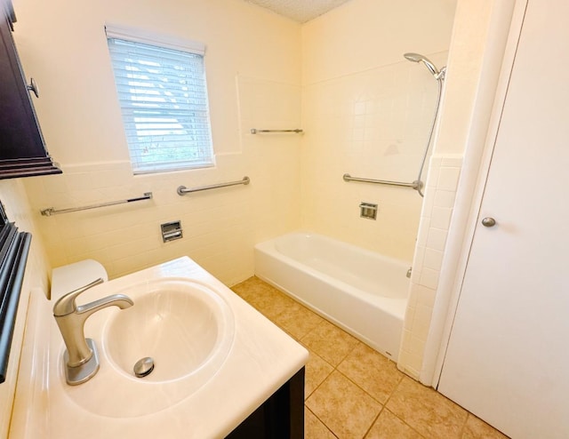 bathroom featuring bathing tub / shower combination, tile walls, wainscoting, tile patterned flooring, and vanity