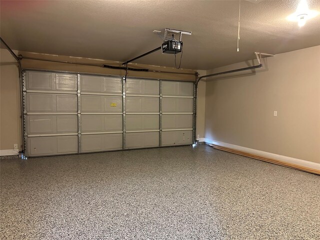 1114 N Elm St, Weatherford, TX 76086 - garage featuring a garage door opener and baseboards