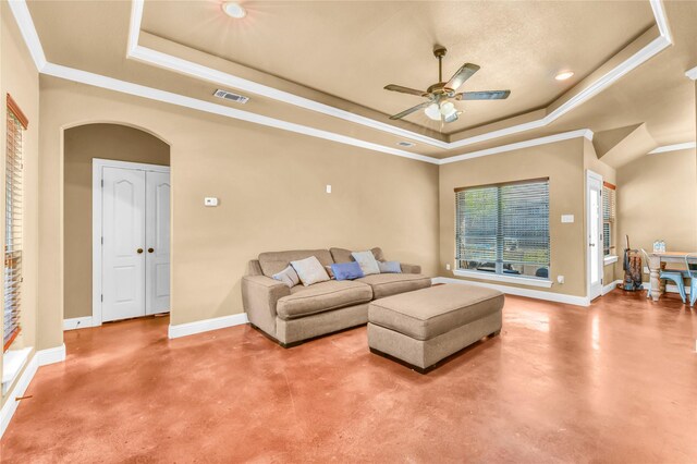 1114 N Elm St, Weatherford, TX 76086 - living room with a raised ceiling, concrete floors, a ceiling fan, baseboards, and ornamental molding