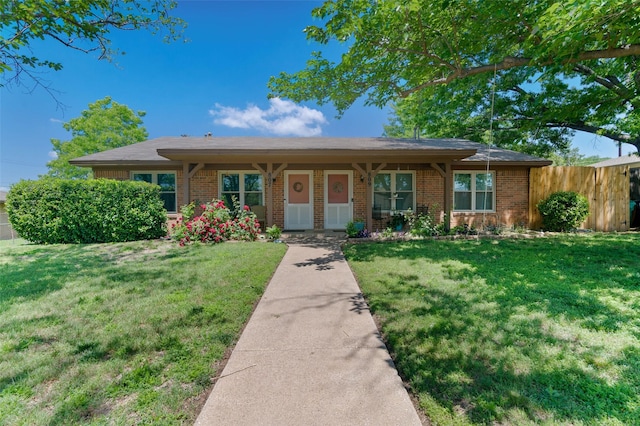 807-809 Sun Valley Dr, Denton, TX 76209 - ranch-style home with brick siding, a front lawn, and fence