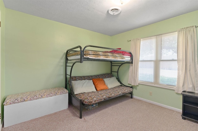 807-809 Sun Valley Dr, Denton, TX 76209 - carpeted bedroom featuring baseboards, a textured ceiling, and visible vents