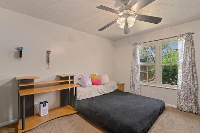 807-809 Sun Valley Dr, Denton, TX 76209 - bedroom with ceiling fan, carpet floors, a textured ceiling, and baseboards