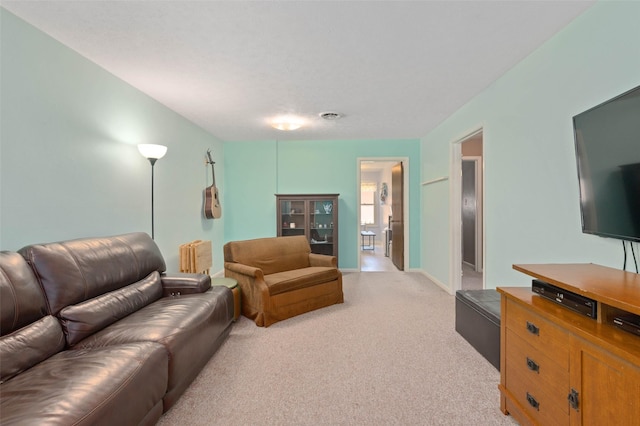 807-809 Sun Valley Dr, Denton, TX 76209 - living room featuring light carpet and baseboards