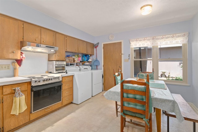 807-809 Sun Valley Dr, Denton, TX 76209 - kitchen featuring light countertops, electric range oven, under cabinet range hood, and washer and clothes dryer