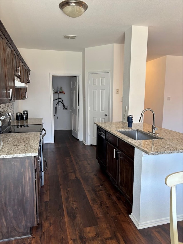 kitchen featuring dark brown cabinets, visible vents, electric stove, a sink, and black dishwasher