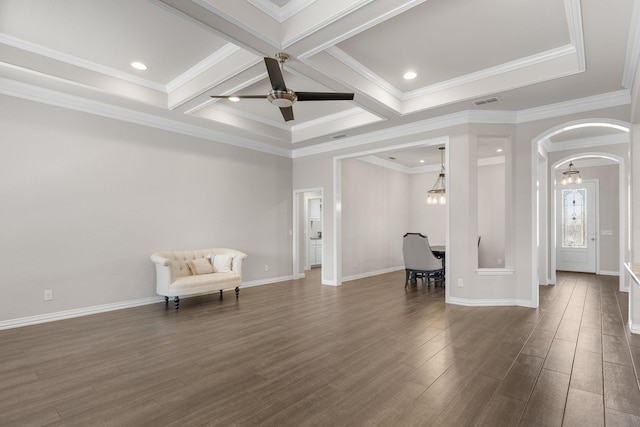 interior space featuring ceiling fan, arched walkways, dark wood-type flooring, baseboards, and beam ceiling