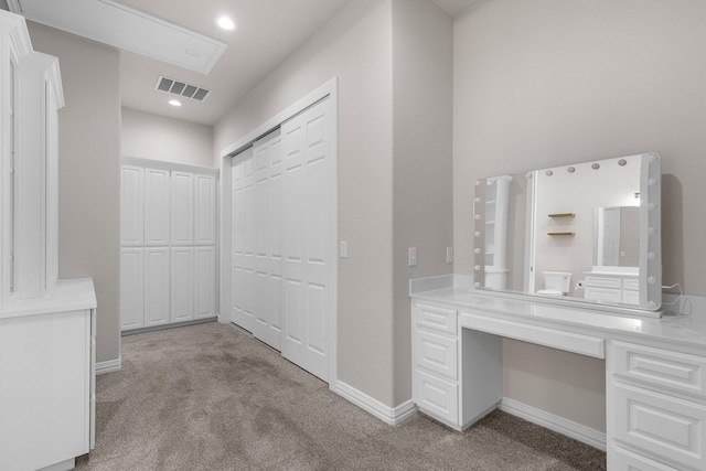 hall with light colored carpet, baseboards, visible vents, and recessed lighting