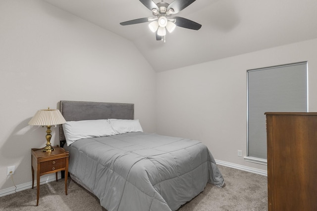 bedroom with lofted ceiling, carpet flooring, baseboards, and a ceiling fan