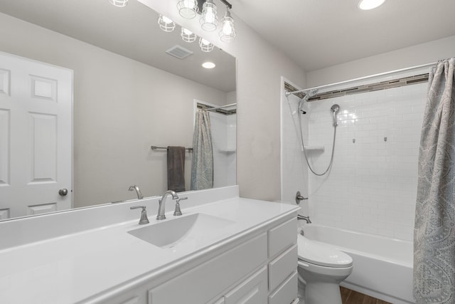 bathroom featuring vanity, shower / tub combo, toilet, visible vents, and recessed lighting
