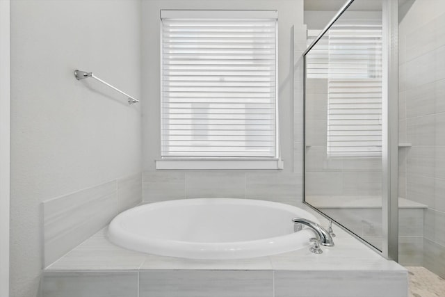 full bath with a garden tub