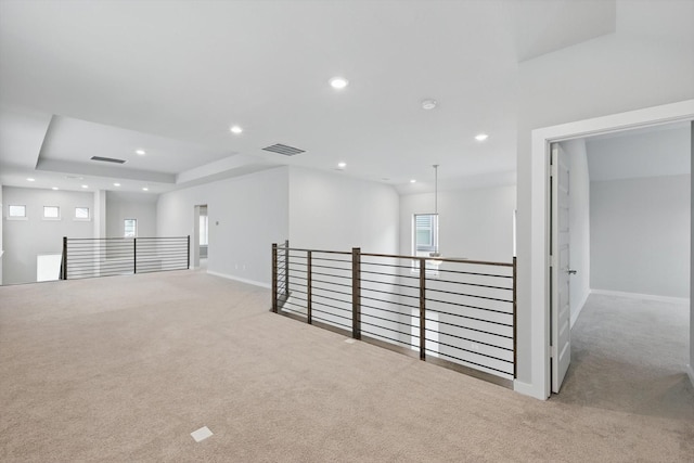 empty room featuring baseboards, visible vents, carpet flooring, and recessed lighting