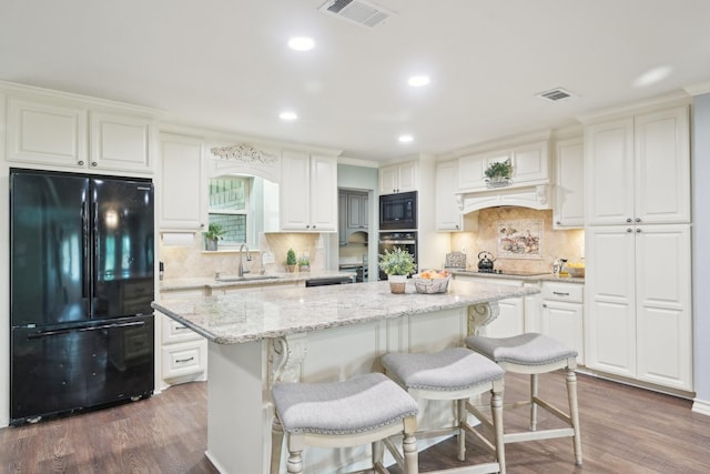 108 N Westlake Dr, Leonard, TX 75452 - kitchen featuring black appliances, a sink, a center island, dark wood-style flooring, and recessed lighting