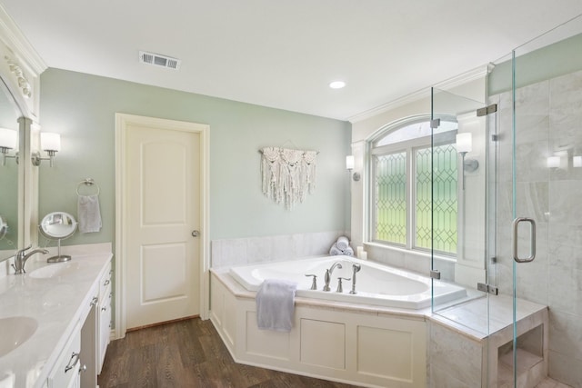 108 N Westlake Dr, Leonard, TX 75452 - bathroom with a garden tub, a stall shower, wood finished floors, and double vanity