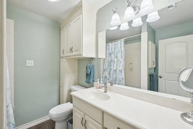 108 N Westlake Dr, Leonard, TX 75452 - full bathroom with wood finished floors, baseboards, toilet, vanity, and a chandelier