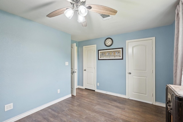 108 N Westlake Dr, Leonard, TX 75452 - unfurnished bedroom with wood finished floors, baseboards, and ceiling fan