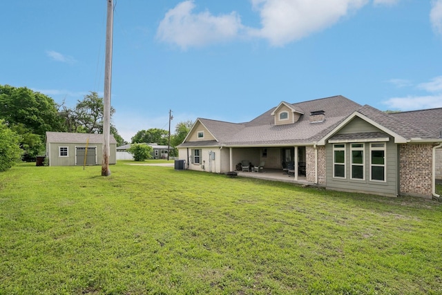 108 N Westlake Dr, Leonard, TX 75452 - rear view of property with a patio, a yard, an outbuilding, and brick siding