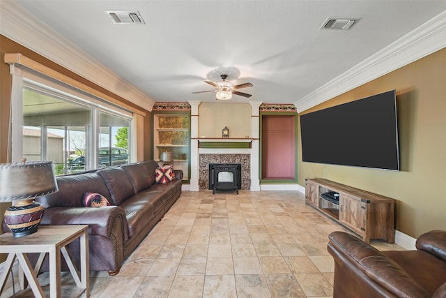 living room featuring visible vents, a ceiling fan, ornamental molding, baseboards, and a fireplace