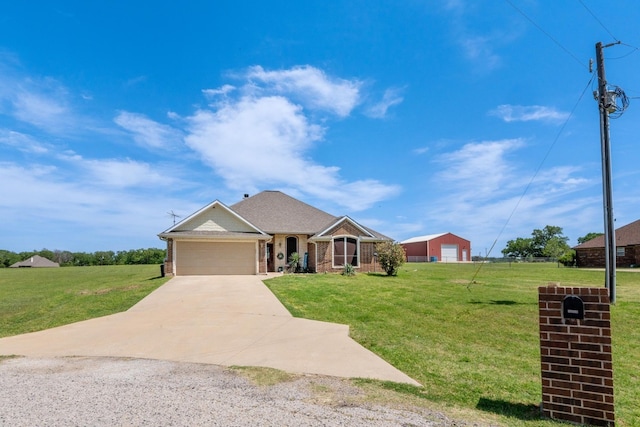 ranch-style house with a front lawn, brick siding, and concrete driveway
