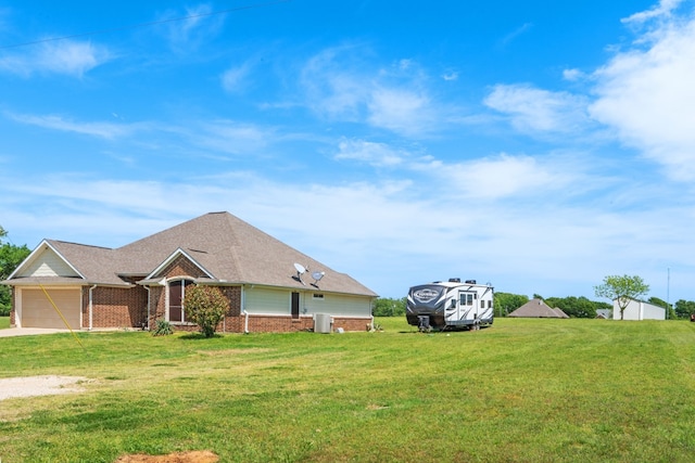 view of front facade featuring brick siding, a front lawn, and a garage